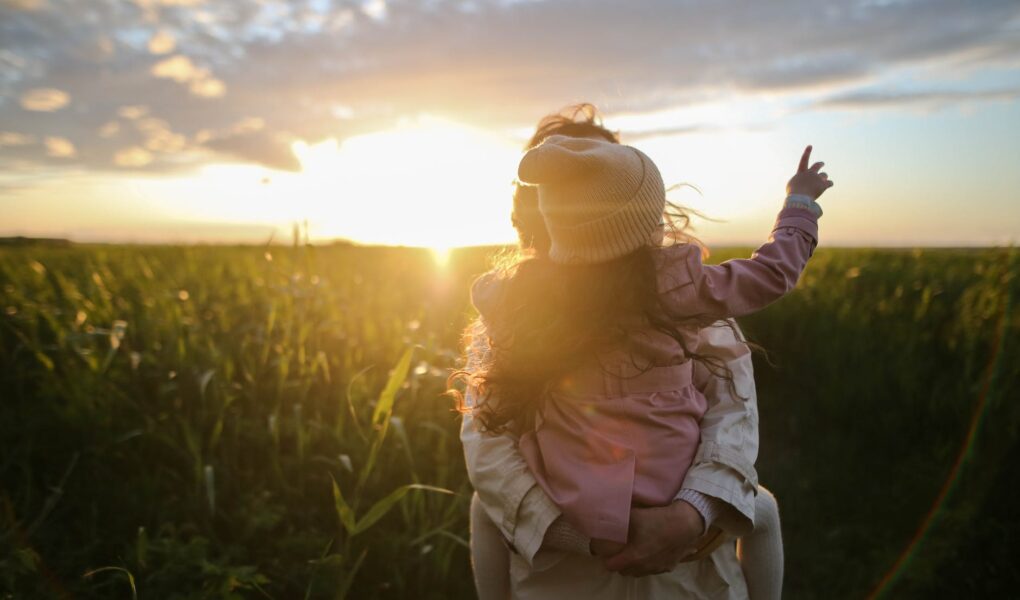 mother and daughter on grass